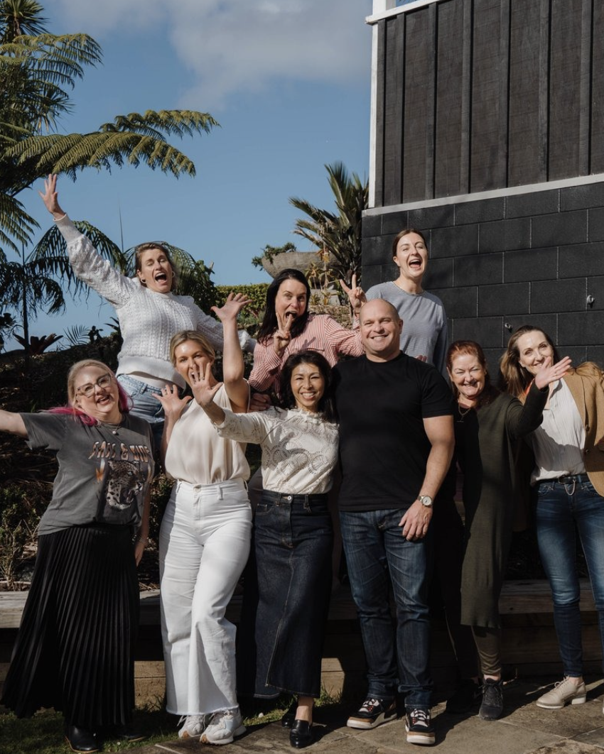 The re:ampd team waving and celebrating outdoors