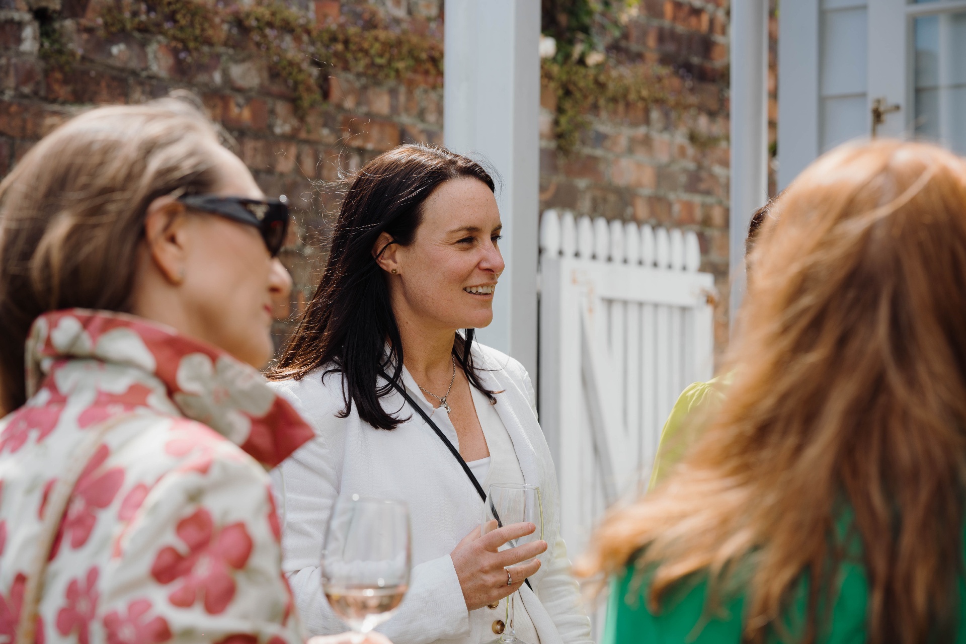 Members chatting at the garden party